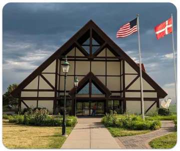 Danish village facade with U.S. and Danish flags