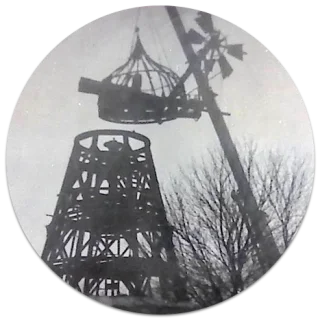 Windmill tower being disassembled piece by piece