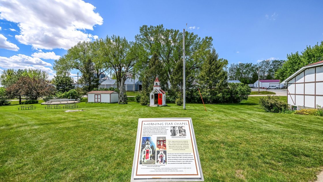 Outdoor campus area showing Grounds Interpretive Sign.