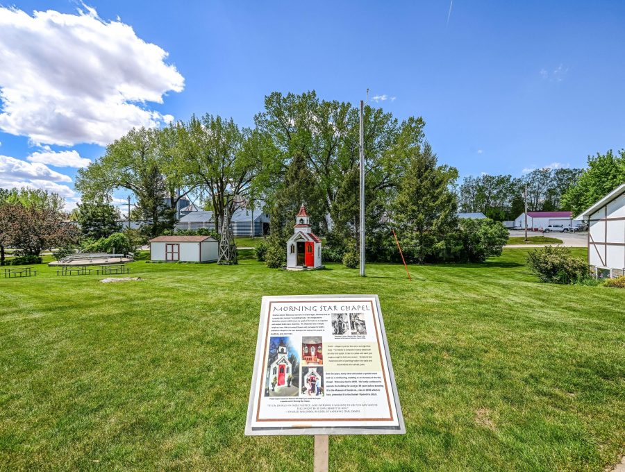 Outdoor campus area showing Grounds Interpretive Sign.