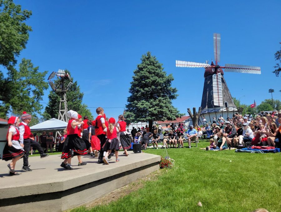 Folk dancers performing outdoors near the Danish Windmill.